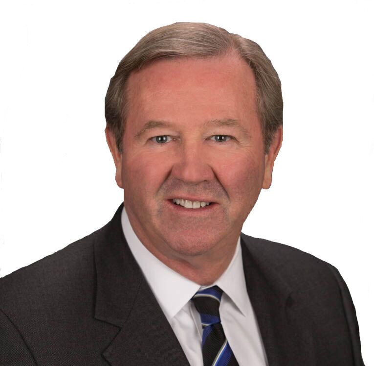Professional middle-aged man in suit and striped tie.