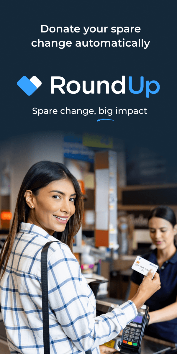 Woman using card at a checkout counter.
